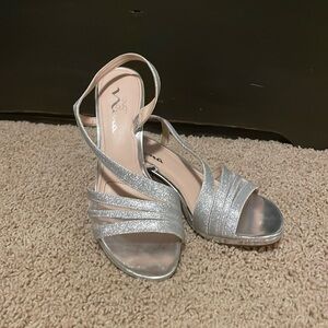 Touch of Nina silver 2 inch heel with sling back strap.